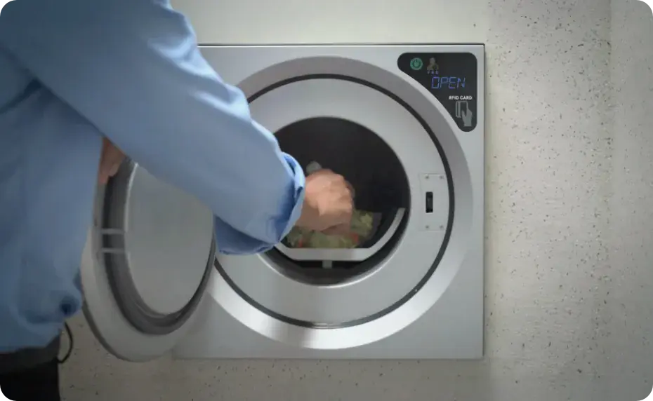 Resident using the waste collection system